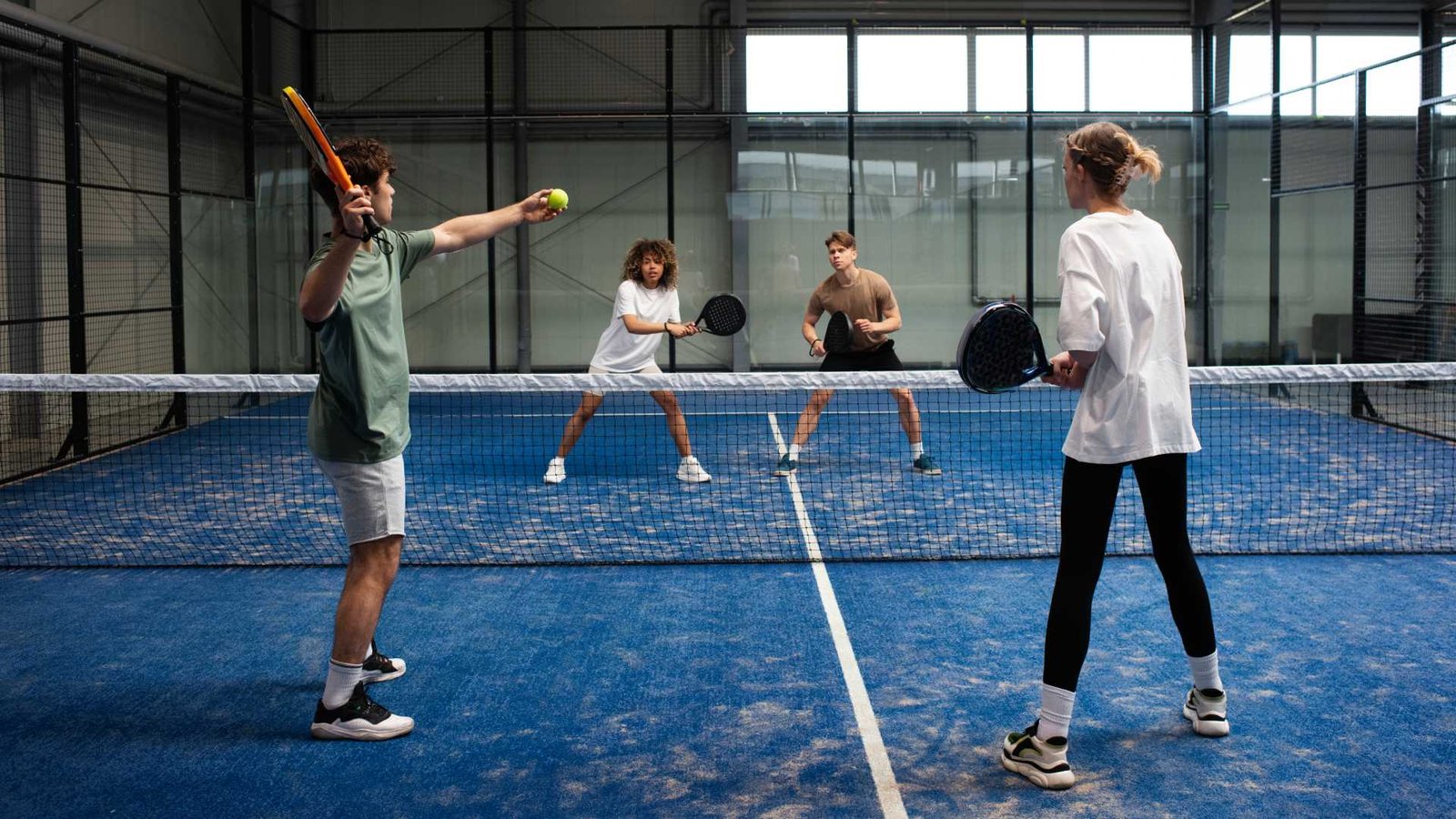 people-playing-padle-tennis-inside